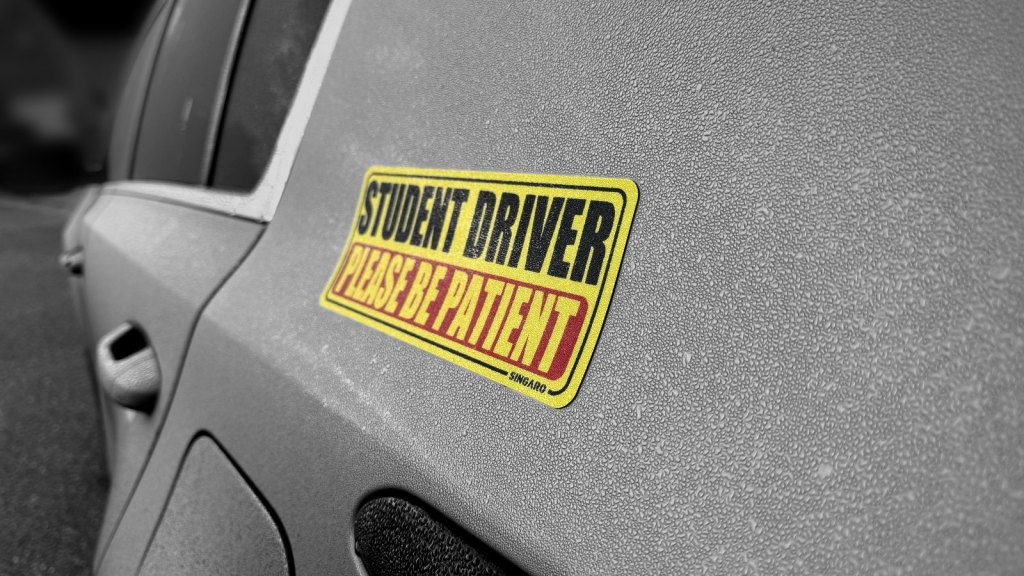 Student driver magnet on the side of a car